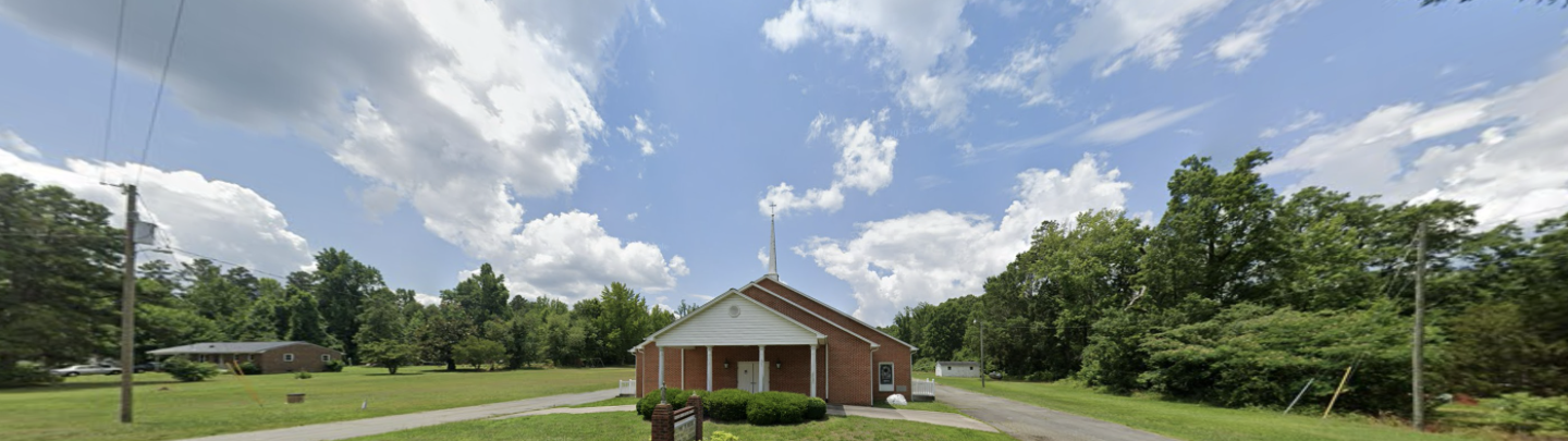 Hester Grove Baptist Church building surrounded by trees